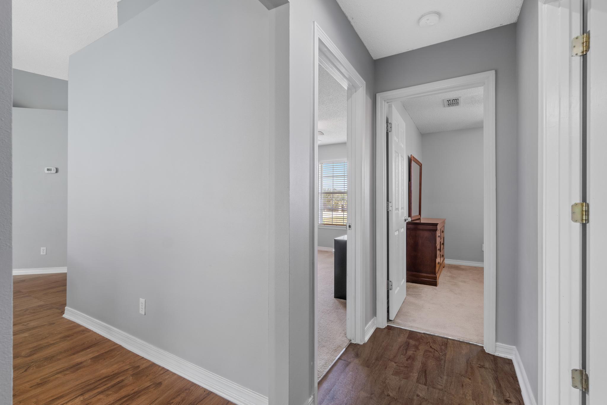 237 Trish Drive Crestview, FL 32536 - Photo 25 of 41 a view of a hallway with wooden floor