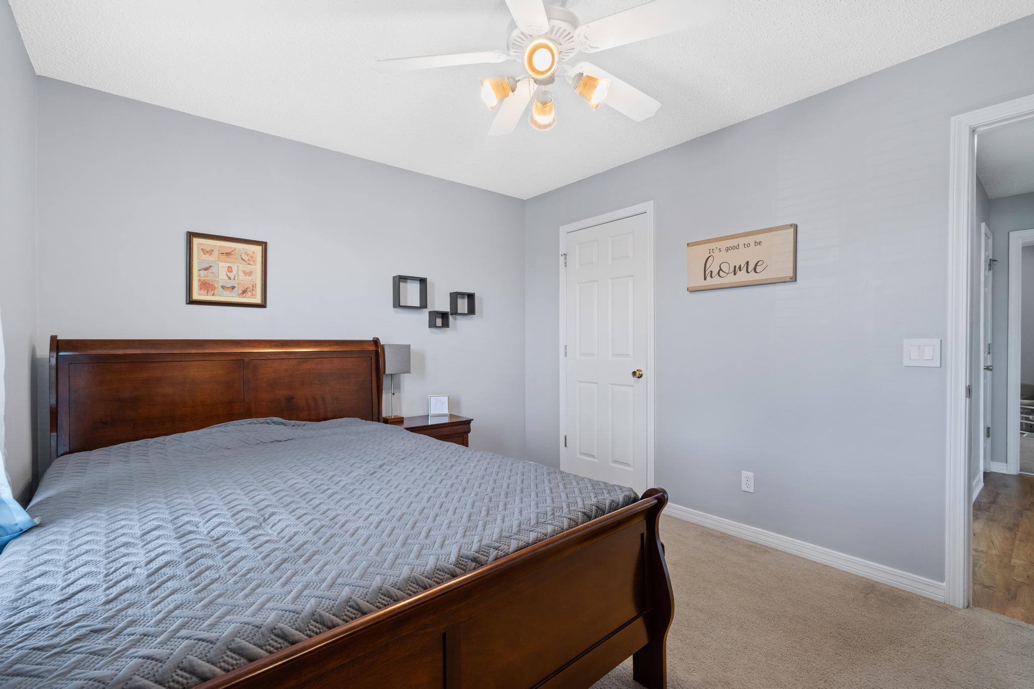 237 Trish Drive Crestview, FL 32536 - Photo 28 of 41 a bedroom with a bed and a chandelier