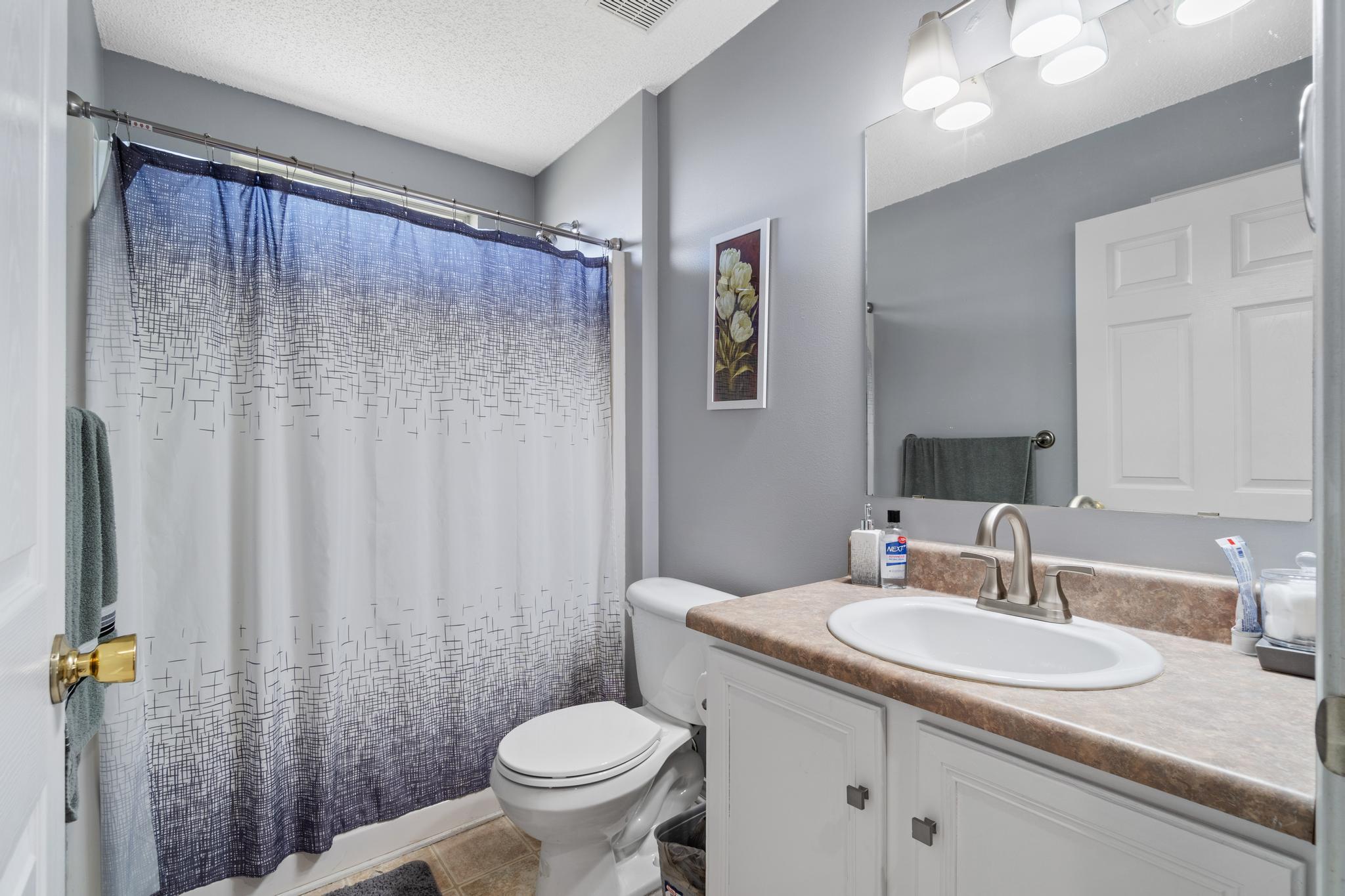 237 Trish Drive Crestview, FL 32536 - Photo 31 of 41 a bathroom with a granite countertop sink and a mirror