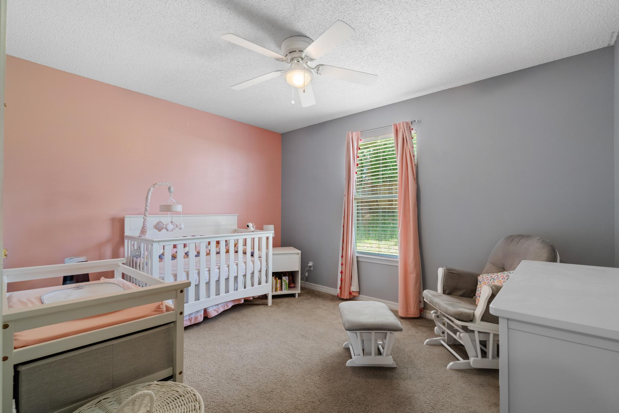 237 Trish Drive Crestview, FL 32536 - Photo 33 of 41 a bedroom with a bed and a chandelier