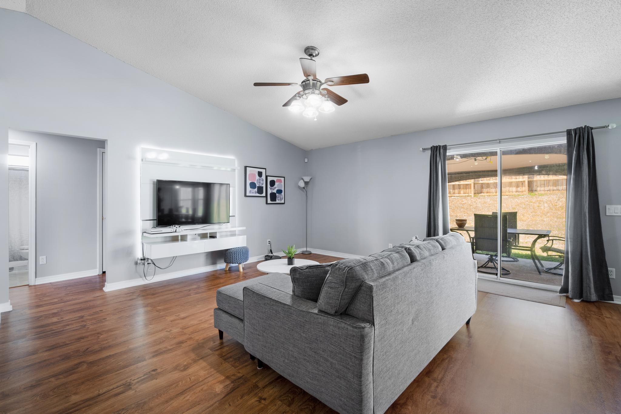 237 Trish Drive Crestview, FL 32536 - Photo 5 of 41 a living room with furniture and a flat screen tv
