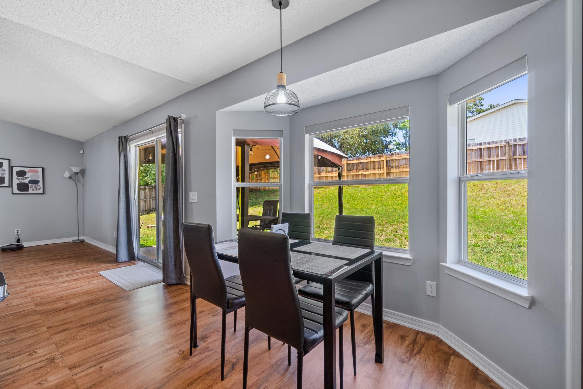 237 Trish Drive Crestview, FL 32536 - Photo 8 of 41 a view of a dining room with furniture window and wooden floor