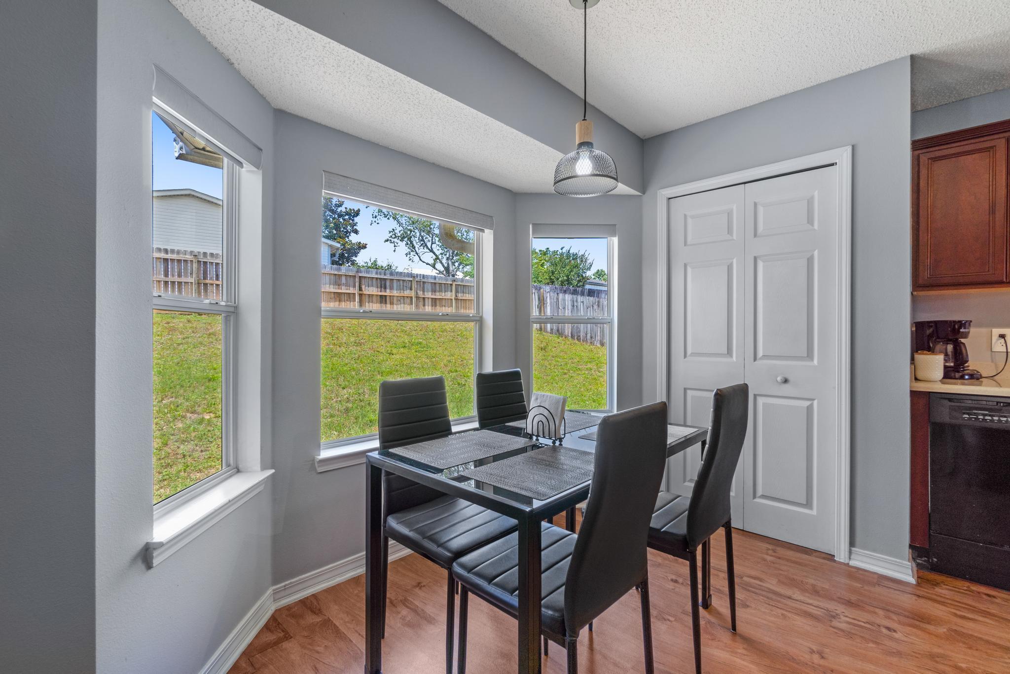 237 Trish Drive Crestview, FL 32536 - Photo 9 of 41 a view of a dining room with furniture and a window