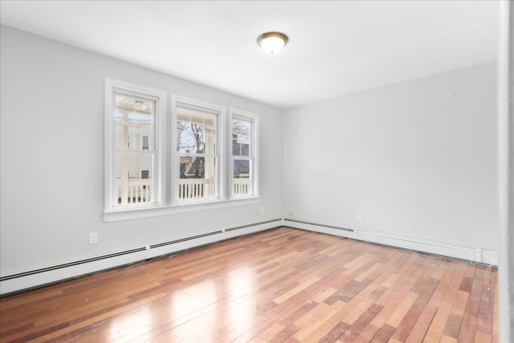 75 Bellevue Street, Unit 2L Boston, MA 02125 - Photo 3 of 10 a view of an empty room with a window