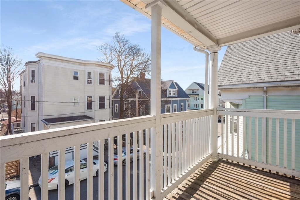 75 Bellevue Street, Unit 2L Boston, MA 02125 - Photo 9 of 10 a view of a house with a small yard