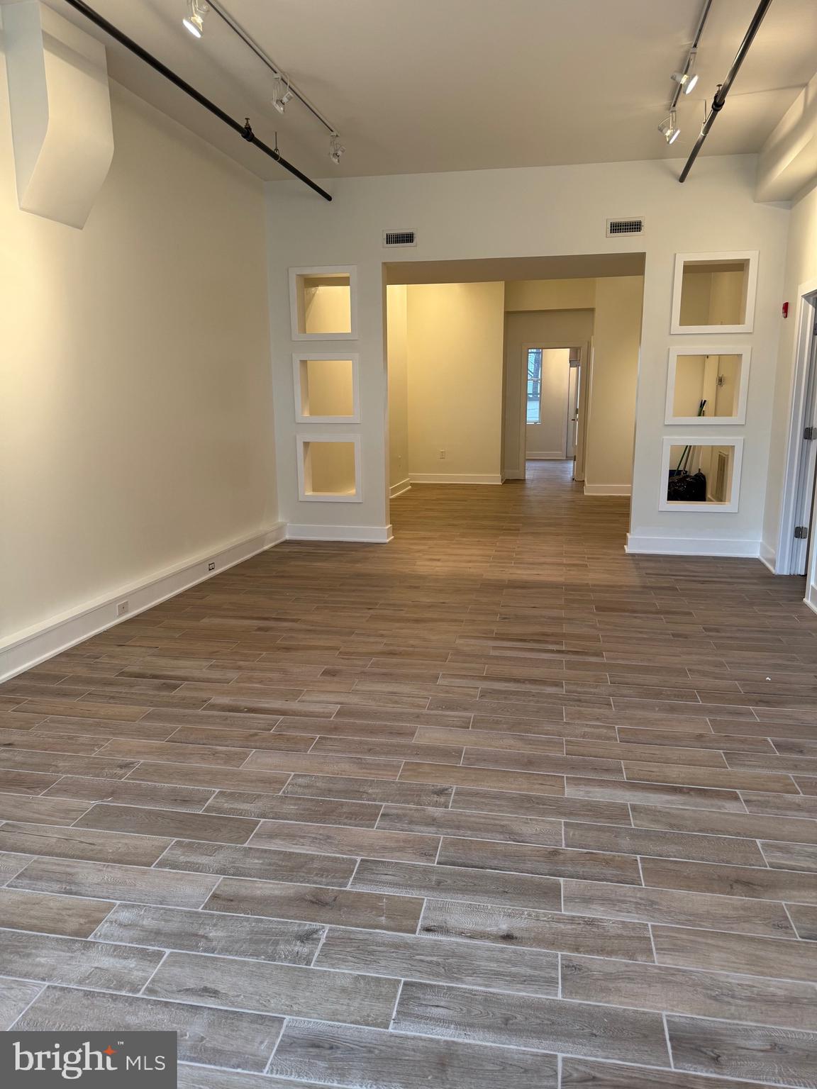 4334 Farragut Street, Unit H Hyattsville, MD 20781 - Photo 2 of 9 a view of an empty room with window and wooden floor