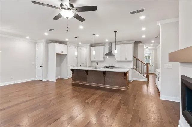a view of kitchen with wooden floor and a window