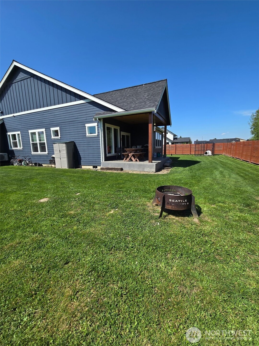 1200 Haystack Lane Everson, WA 98247 - Photo 15 of 16 a backyard of a house with table and chairs