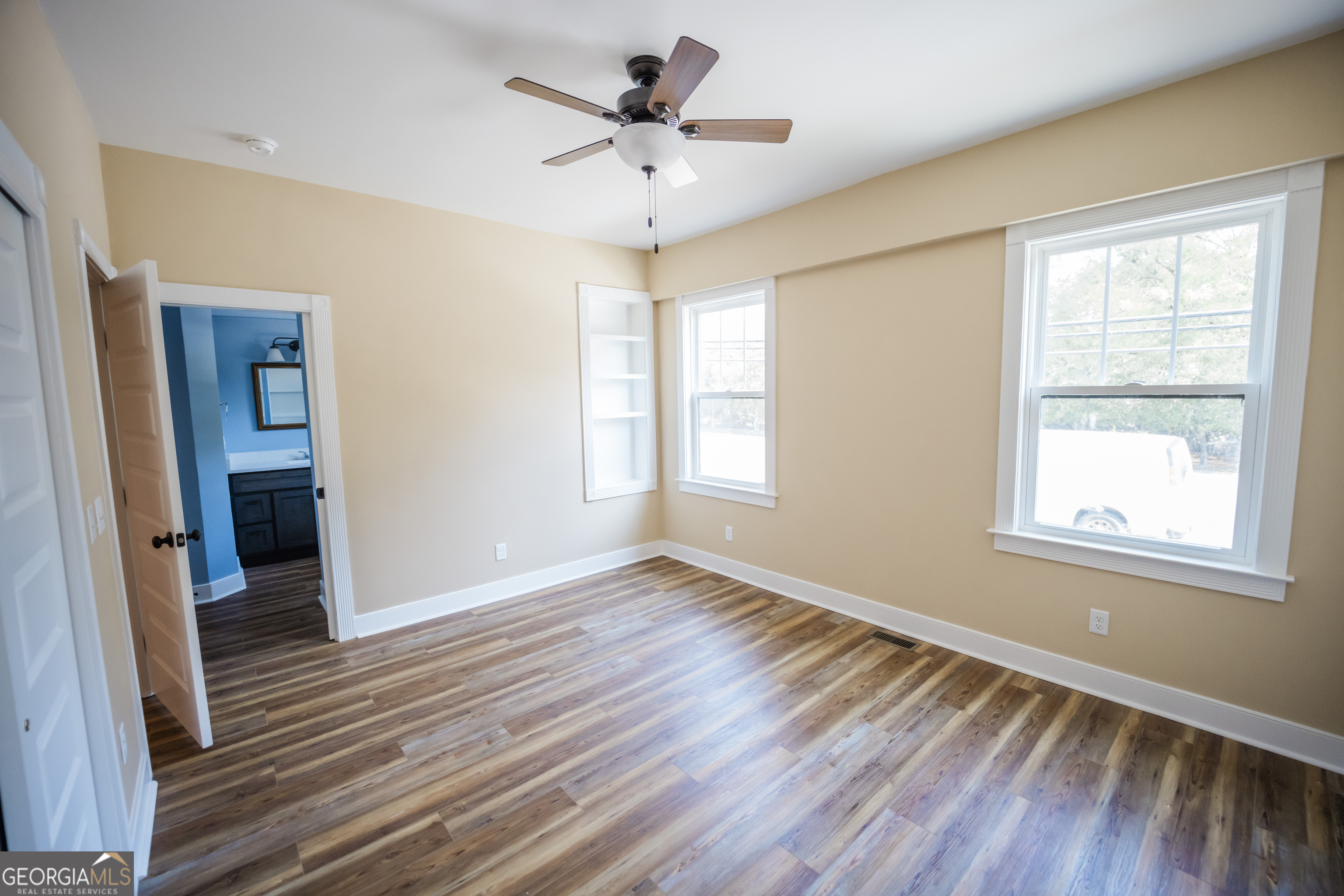 210 West 8th Street, Unit 1 Tifton, GA 31794 - Photo 18 of 23 wooden floor in an empty room with a window