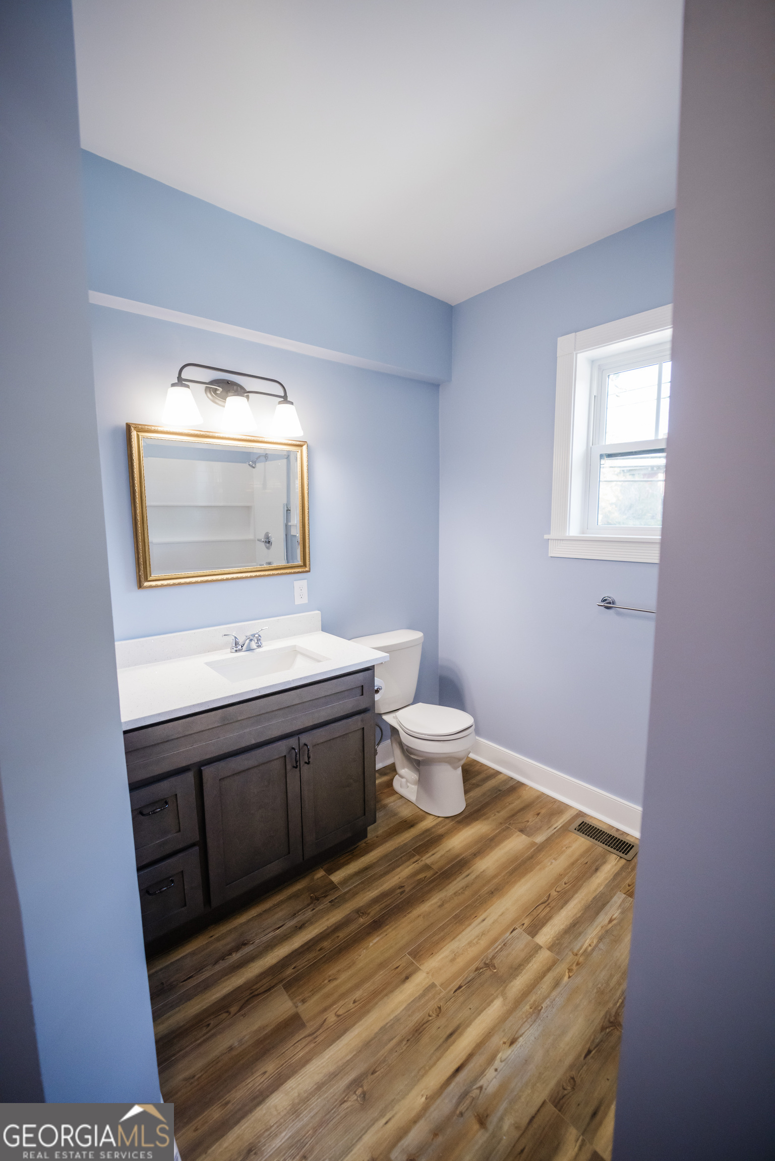 210 West 8th Street, Unit 1 Tifton, GA 31794 - Photo 22 of 23 a bathroom with a sink and a mirror