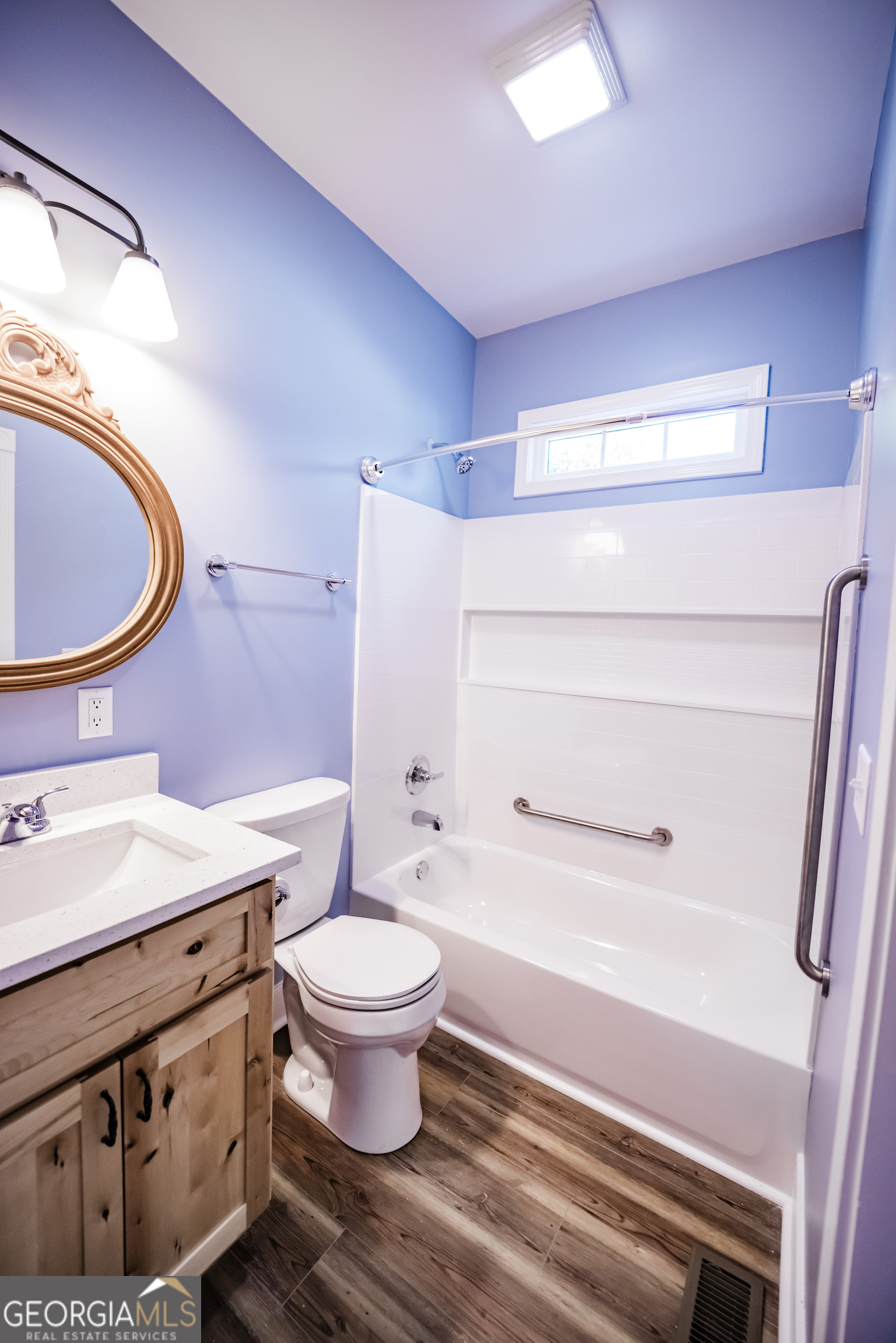 210 West 8th Street, Unit 1 Tifton, GA 31794 - Photo 23 of 23 a bathroom with a sink toilet and a mirror