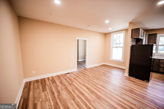 a kitchen with a stove a sink and a microwave