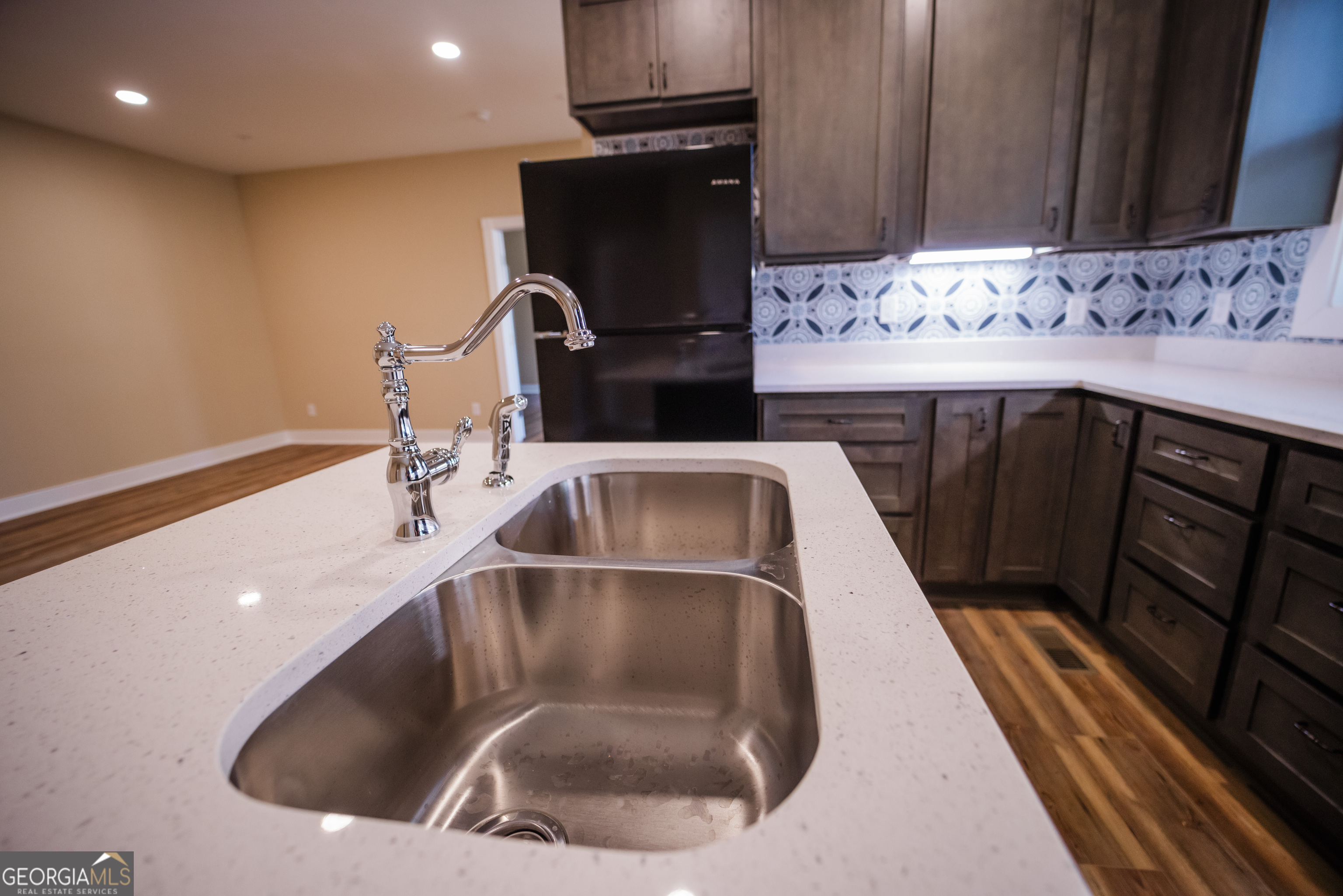 210 West 8th Street, Unit 1 Tifton, GA 31794 - Photo 8 of 23 a kitchen with a sink and a stove top oven
