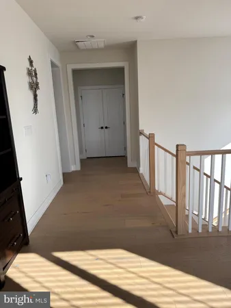 a view of a hallway with a window