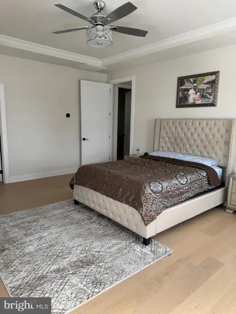 a view of walk in closet with clothes