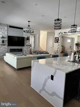 a living room with fireplace furniture and a flat screen tv