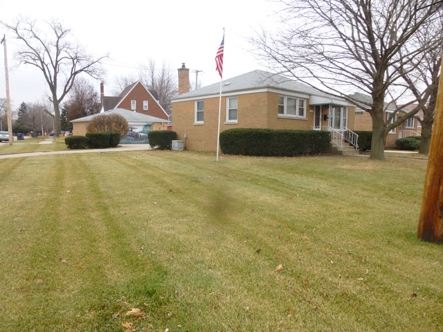 4533 Butterfield Road Hillside, IL 60162 - Photo 3 of 24 a front view of a house with a yard and trees