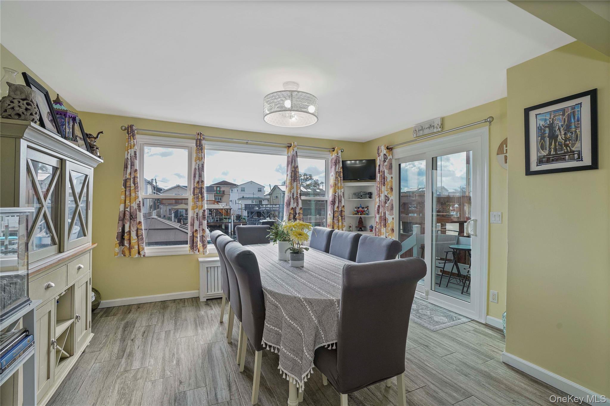 48 Gotham Avenue Brooklyn, NY 11229 - Photo 13 of 38 a dining room with furniture large window and wooden floor