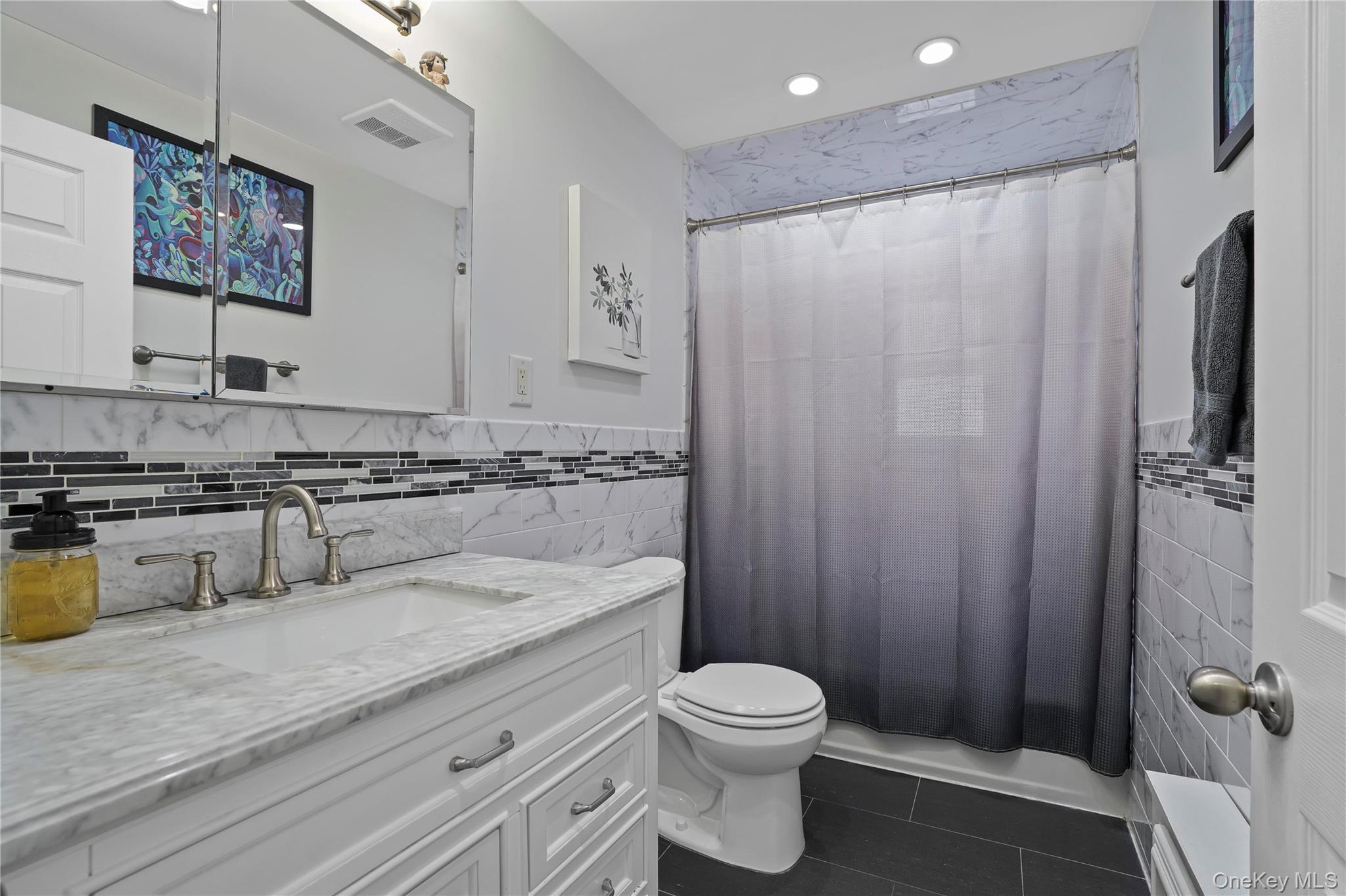 48 Gotham Avenue Brooklyn, NY 11229 - Photo 23 of 38 a bathroom with a granite countertop sink toilet and shower