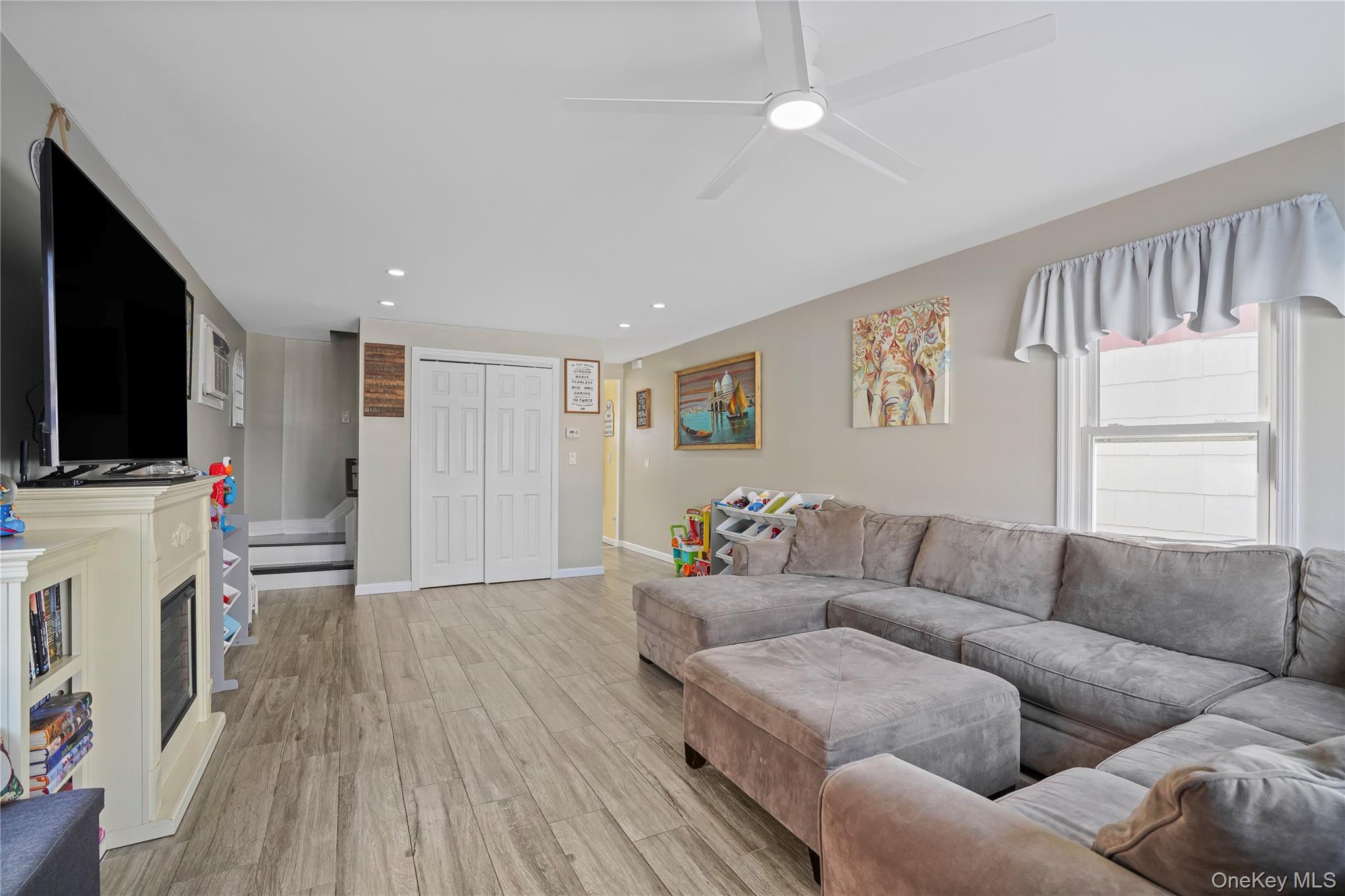 48 Gotham Avenue Brooklyn, NY 11229 - Photo 7 of 38 a living room with furniture and a flat screen tv