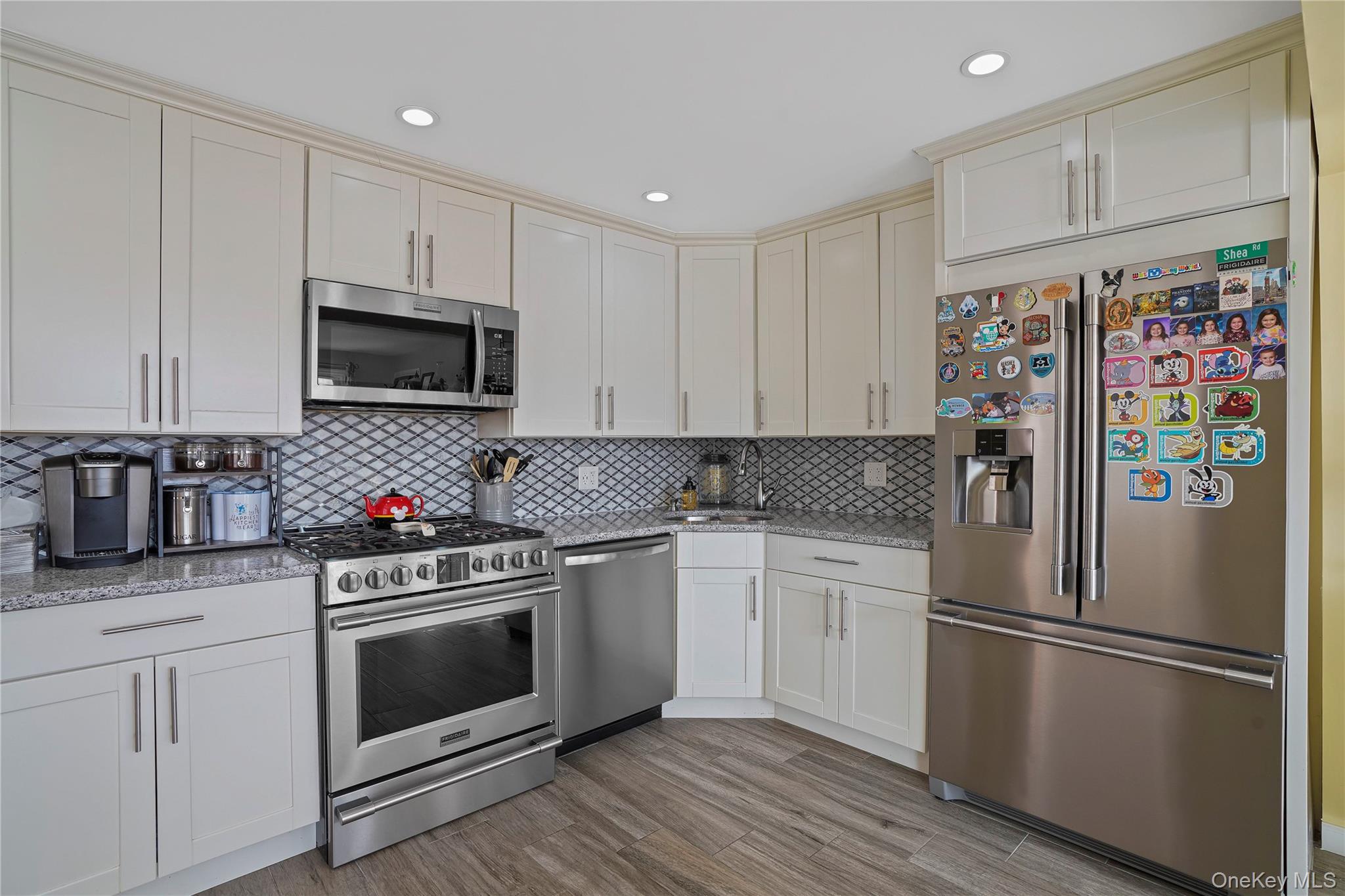 48 Gotham Avenue Brooklyn, NY 11229 - Photo 10 of 38 a kitchen with stainless steel appliances a stove microwave and refrigerator