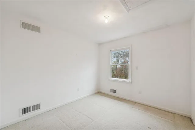 a bathroom with a sink toilet mirror and shower