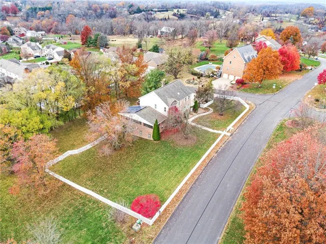 a view of a swimming pool with a yard