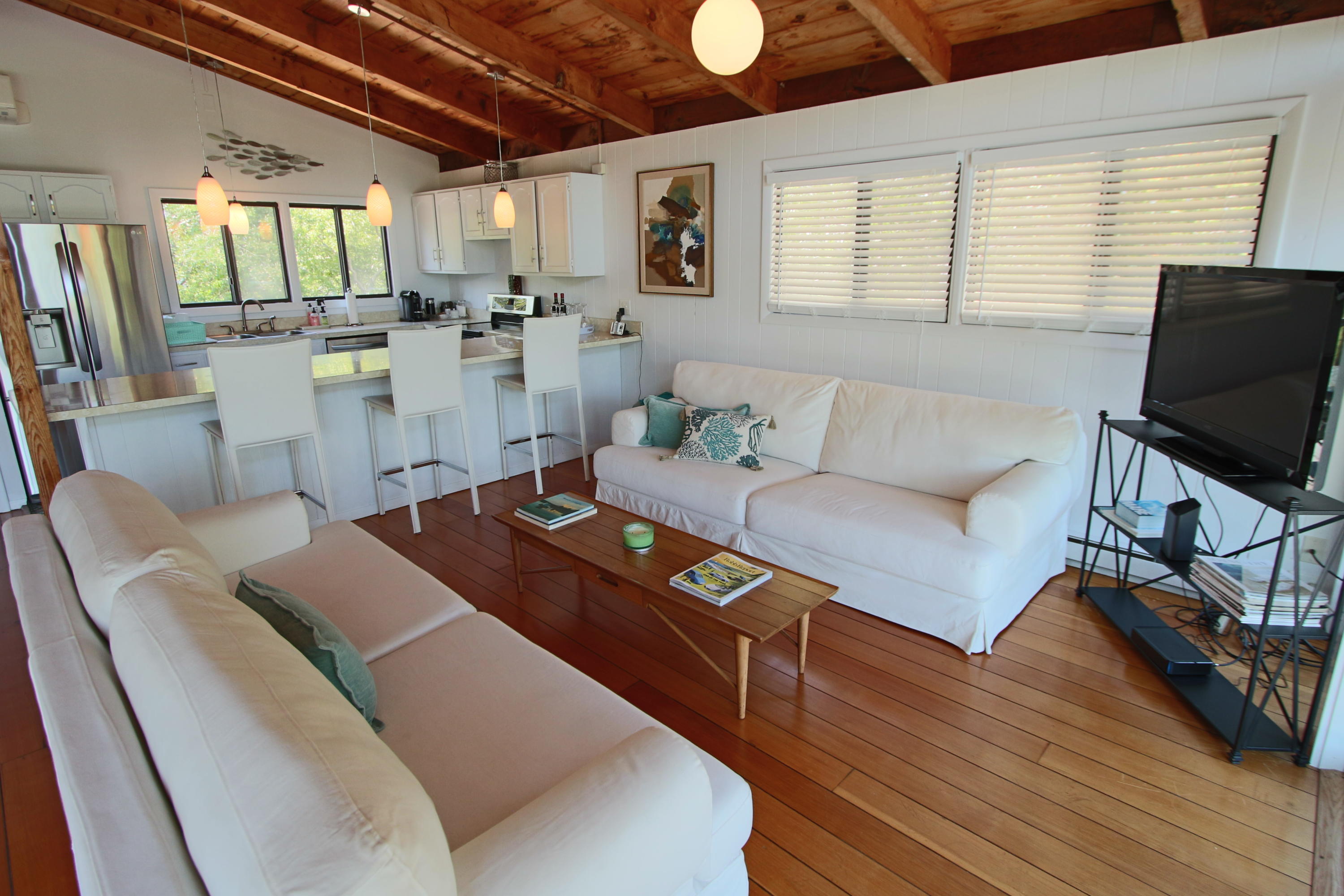 2 Katharine Road Truro, MA 02666 - Photo 16 of 60 a living room with furniture and a flat screen tv