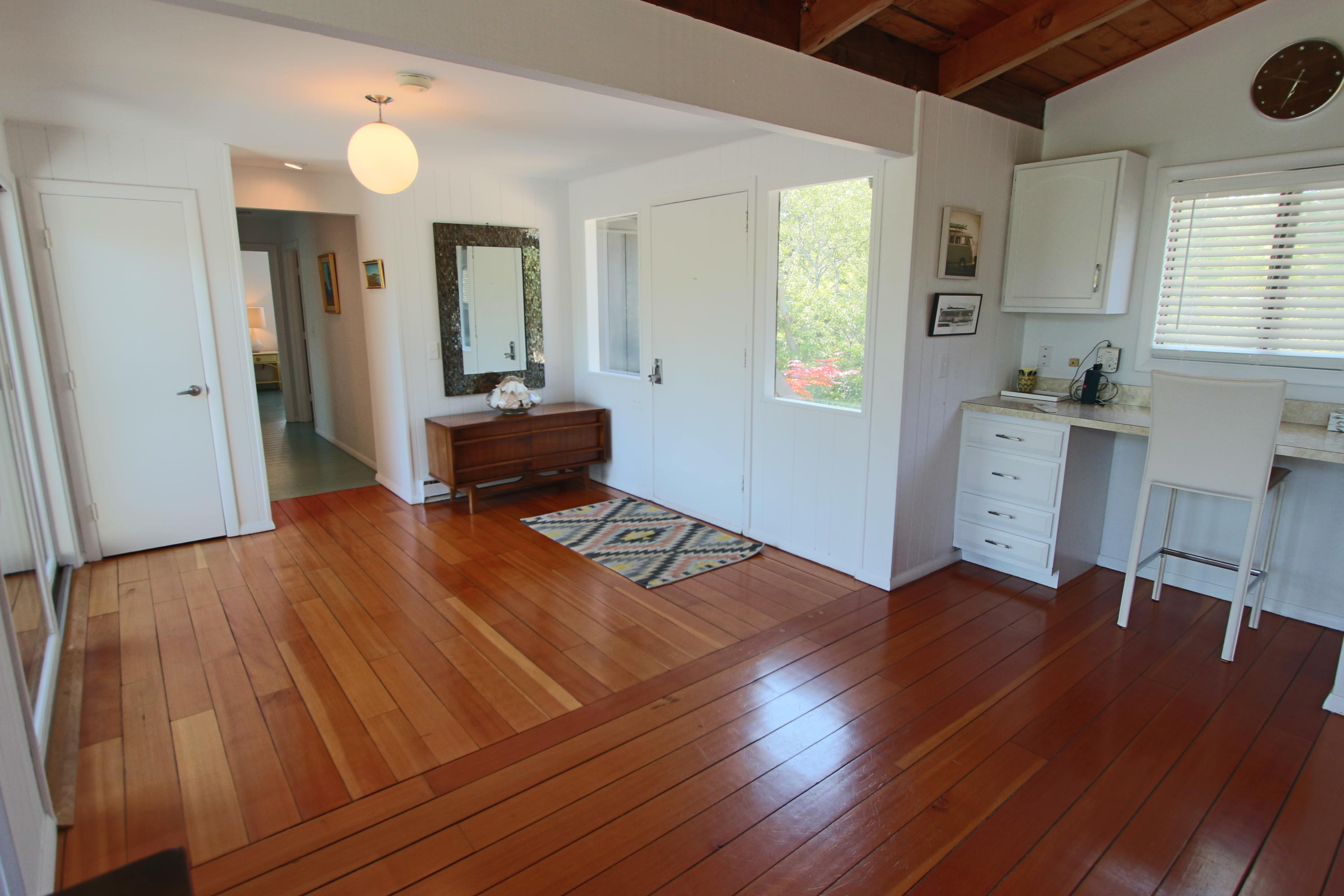 2 Katharine Road Truro, MA 02666 - Photo 20 of 60 a living room with furniture and a wooden floor