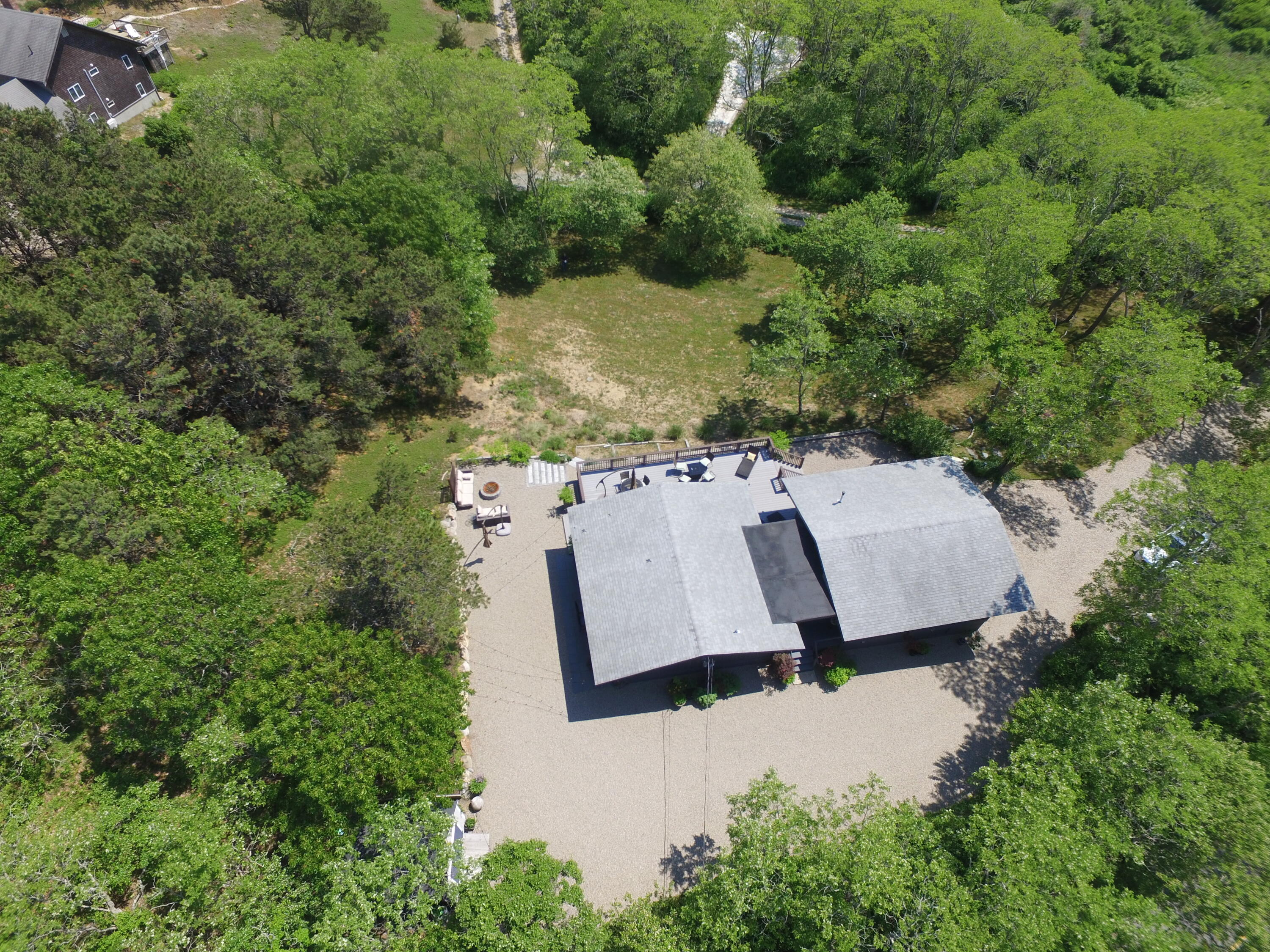 2 Katharine Road Truro, MA 02666 - Photo 2 of 60 an aerial view of a house with yard and outdoor seating