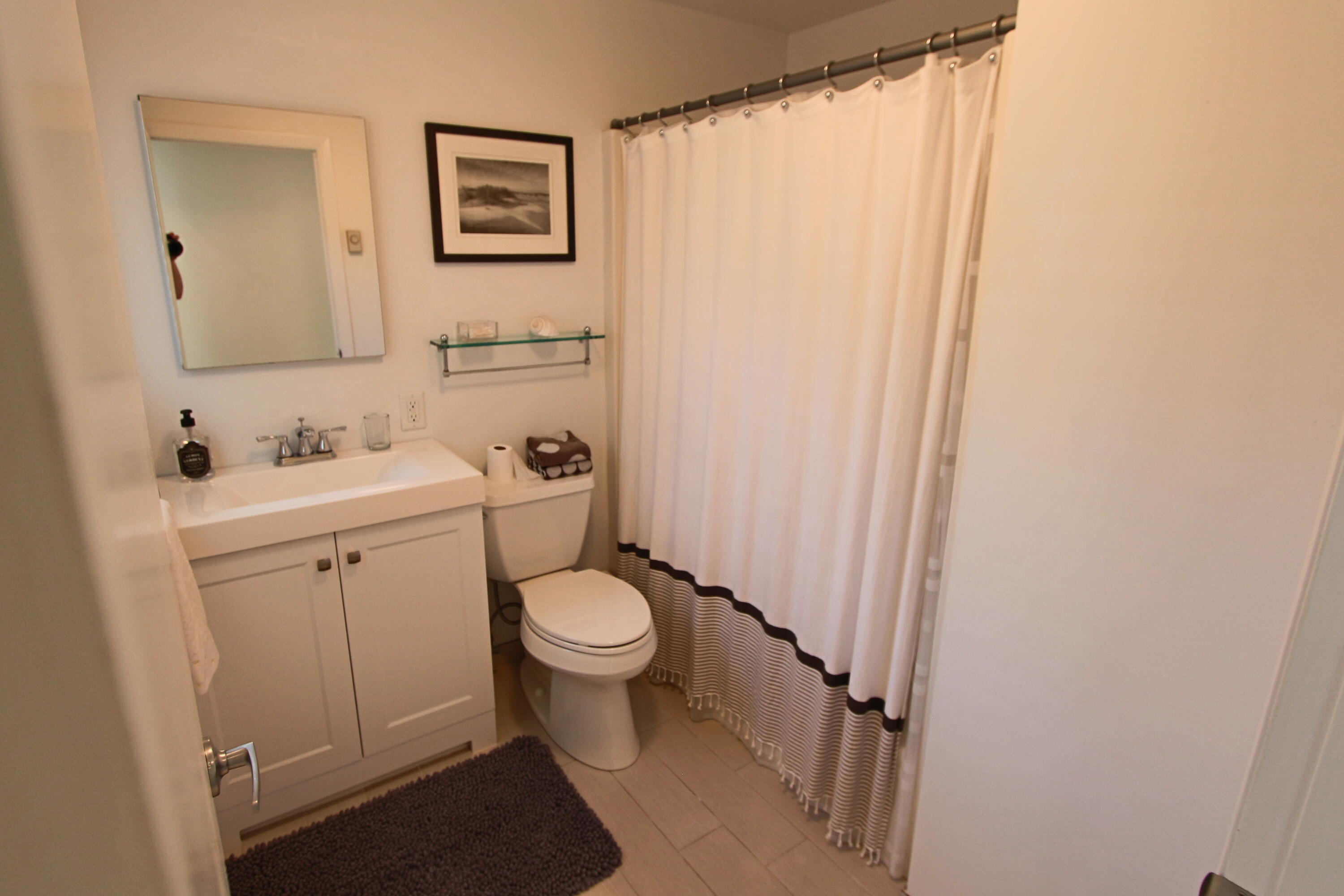 2 Katharine Road Truro, MA 02666 - Photo 22 of 60 a bathroom with a sink toilet and vanity