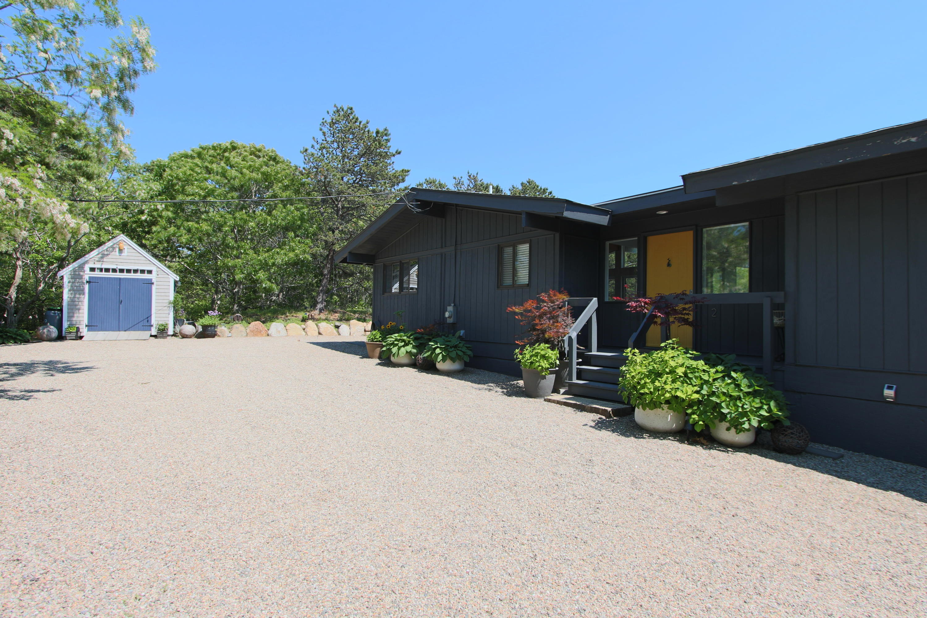 2 Katharine Road Truro, MA 02666 - Photo 33 of 60 front view of a house with potted plants