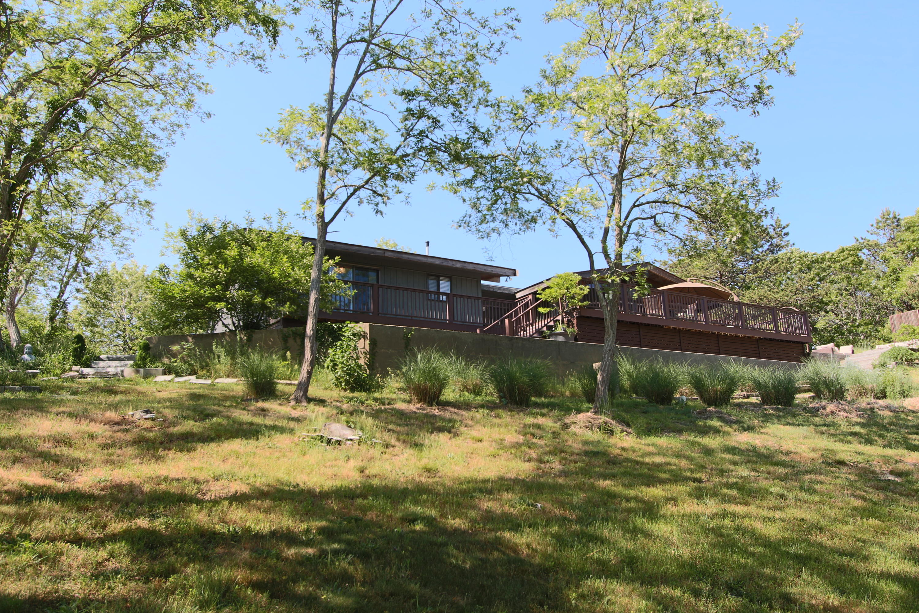 2 Katharine Road Truro, MA 02666 - Photo 36 of 60 a backyard of a house with lots of green space