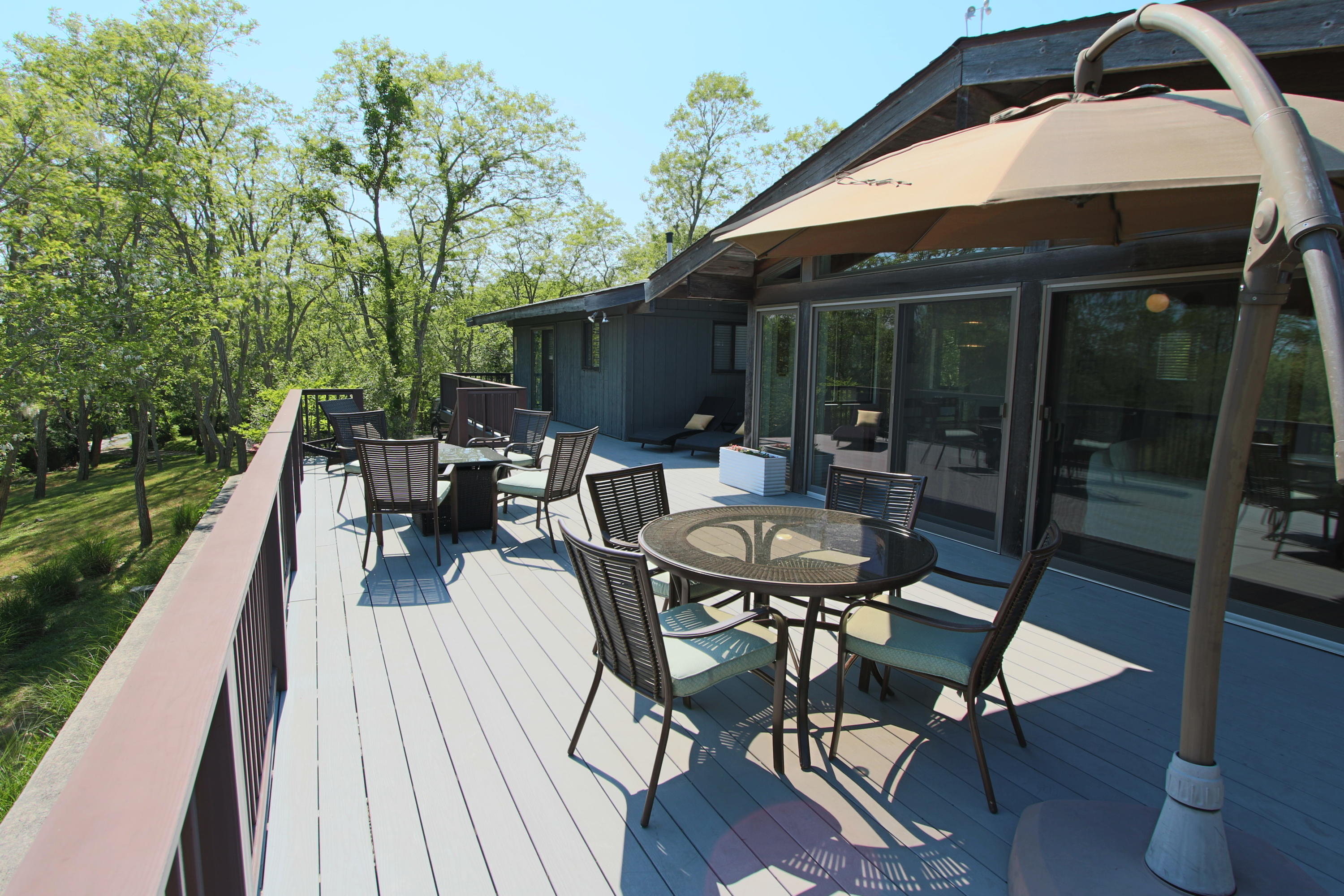 2 Katharine Road Truro, MA 02666 - Photo 9 of 60 a patio with wooden floor table and chairs
