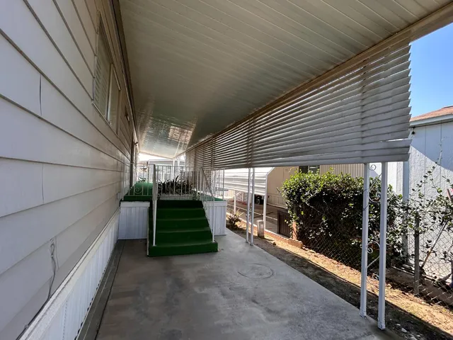 a view of a porch with furniture