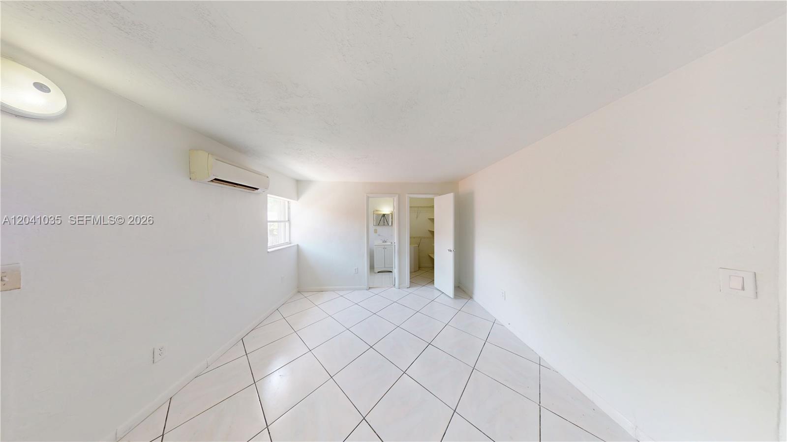 6811 Southwest 16th Street Miami, FL 33144 - Photo 20 of 21 a view of an empty room and window