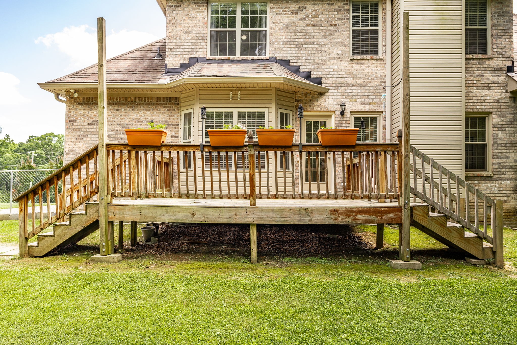 2860 Morgan Road Joelton, TN 37080 - Photo 38 of 45 a view of a house with a wooden deck and a yard