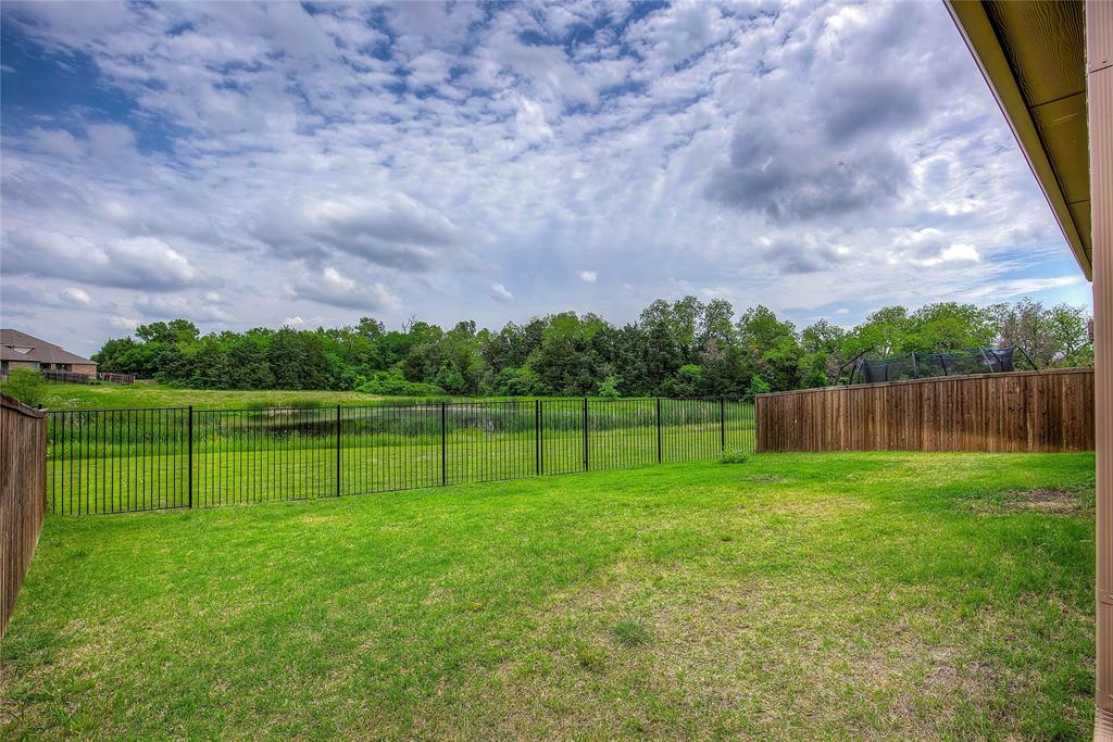 2703 Sayers Way Forney, TX 75126 - Photo 20 of 23 a view of a backyard with a lake view