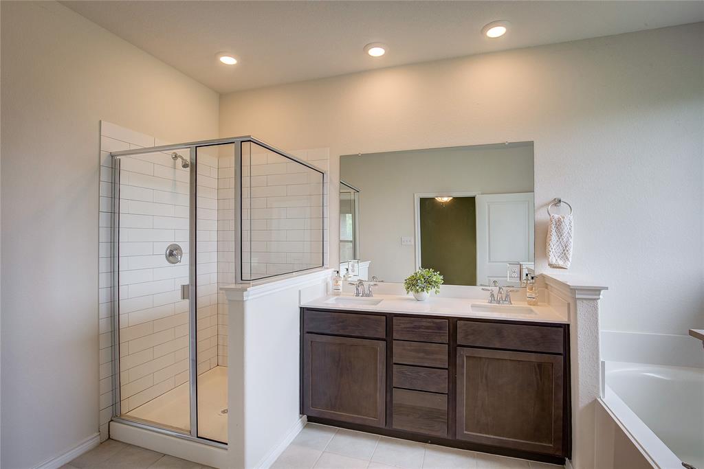 2703 Sayers Way Forney, TX 75126 - Photo 8 of 23 a bathroom with a double vanity sink and mirror