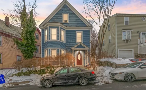 a car parked in front of a house