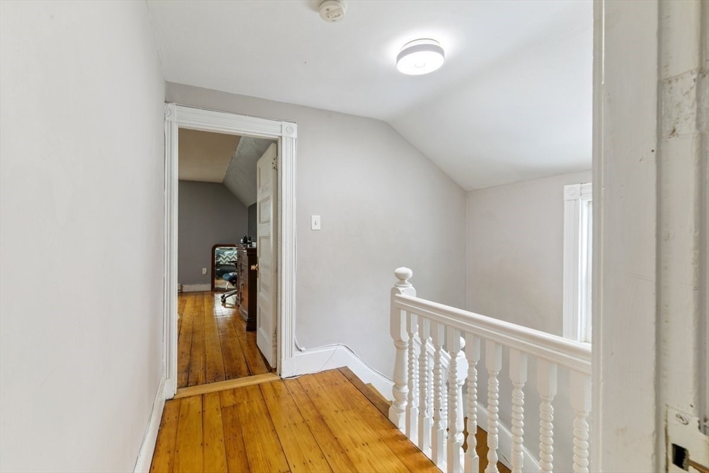 187 Highland Street Boston, MA 02119 - Photo 10 of 21 a view of livingroom with wooden floor