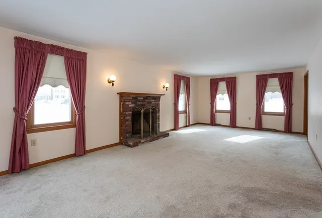 a bathroom with a sink a toilet and a large mirror