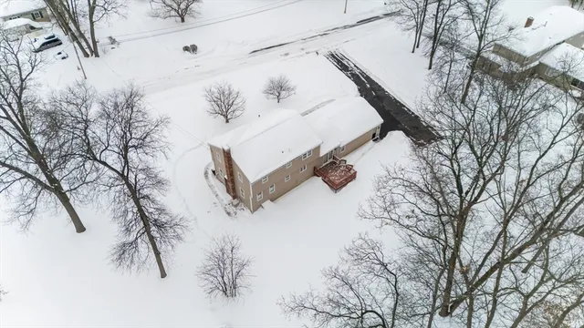 a view of a house with snow on the ground
