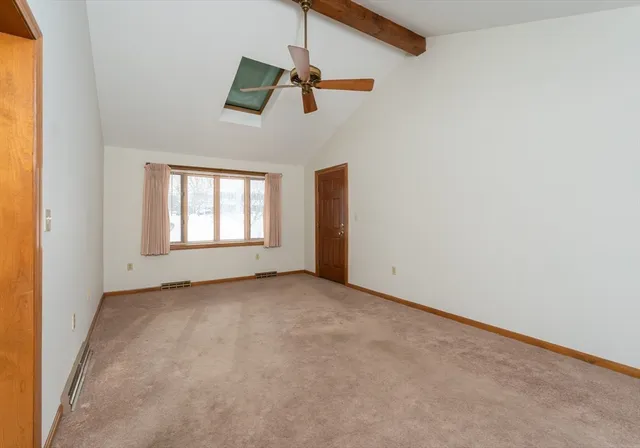 a view of a room with window and chandelier