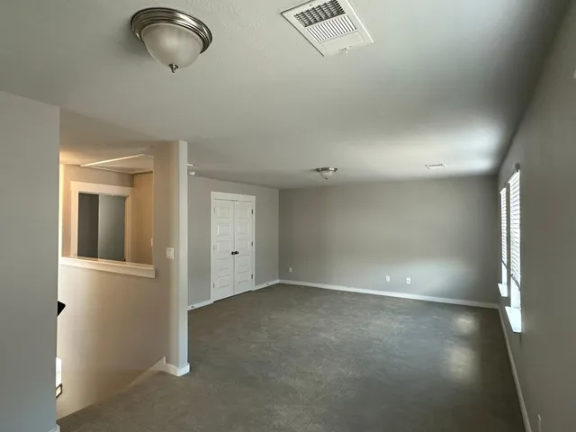 a view of a house with a yard and garage
