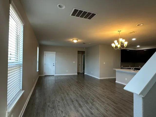 a view of a livingroom with a kitchen