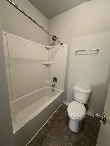 a view of a hallway with wooden shelves