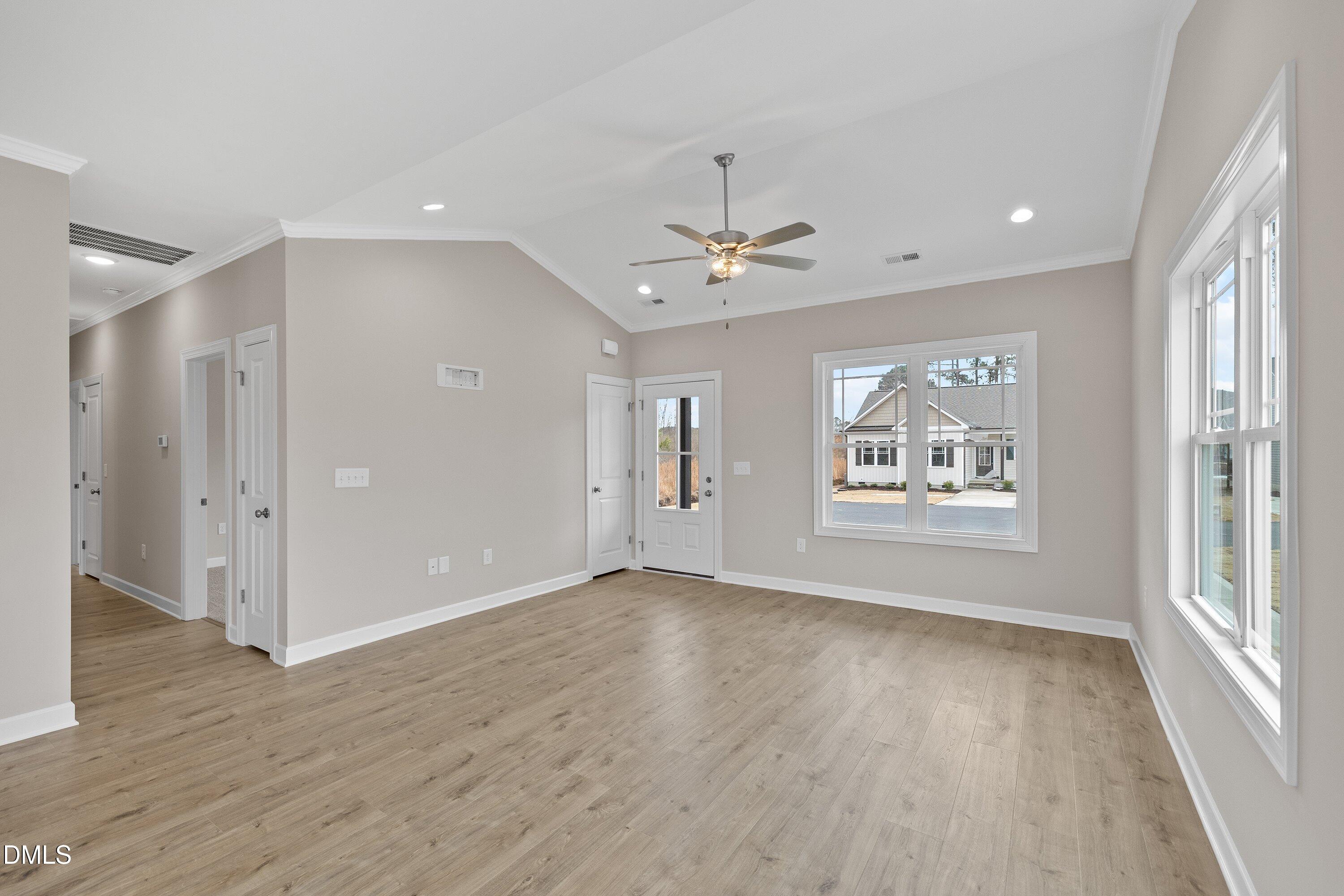926 Micro Road West Selma, NC 27576 - Photo 14 of 41 a view of an empty room with a window and wooden floor