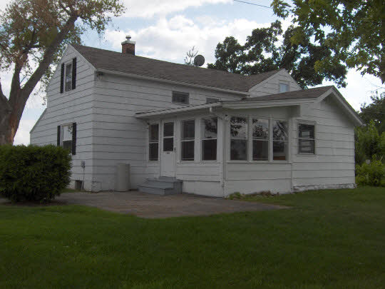 1712 Manchester Road South Beloit, IL 61080 - Photo 1 of 10 a view of house with backyard space and garden