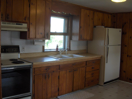 1712 Manchester Road South Beloit, IL 61080 - Photo 4 of 10 a kitchen with a refrigerator stove and cabinets